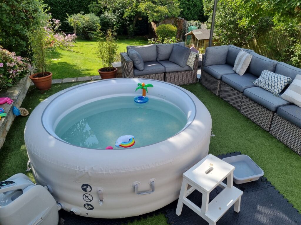 Real Lay-Z-Spa hot tub set up beside garden seating for a celebration