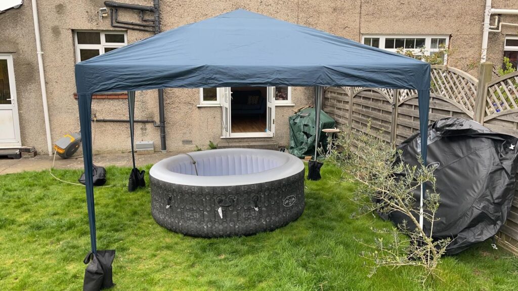 Lay-Z-Spa hot tub set up on a level lawn beneath a gazebo